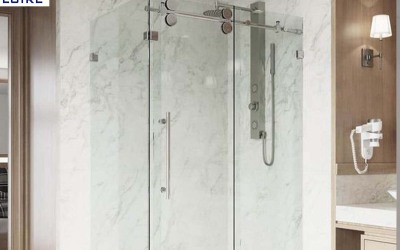 What are the framing options for hinged glass shower doors?