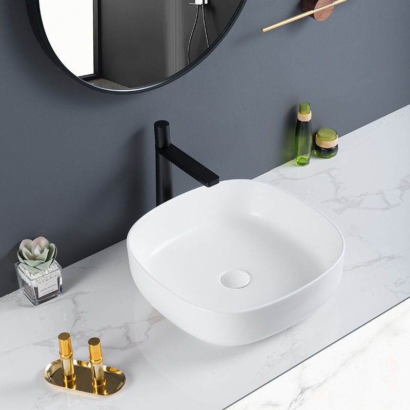 Lavabo de baño de una sola pieza de porcelana resistente y lavabo de encimera